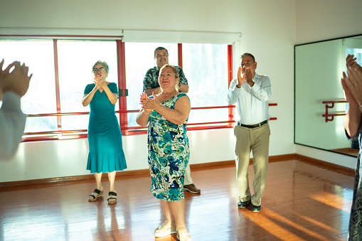 Senior students clapping at a dance studio