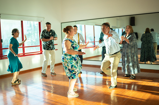 Mature couple dancing at a dance studio