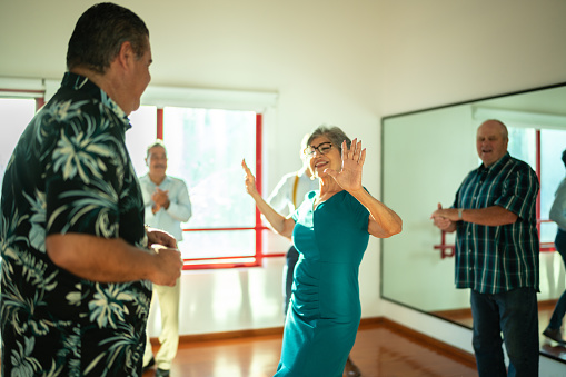 Mature couple dancing at a dance studio