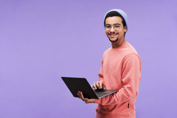 istock Young successful designer or freelancer in casualwear using laptop 1450035681