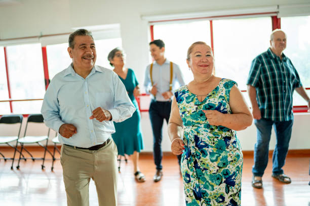 istock Group of seniors friends at a dancing class at the dance studio 1450035774