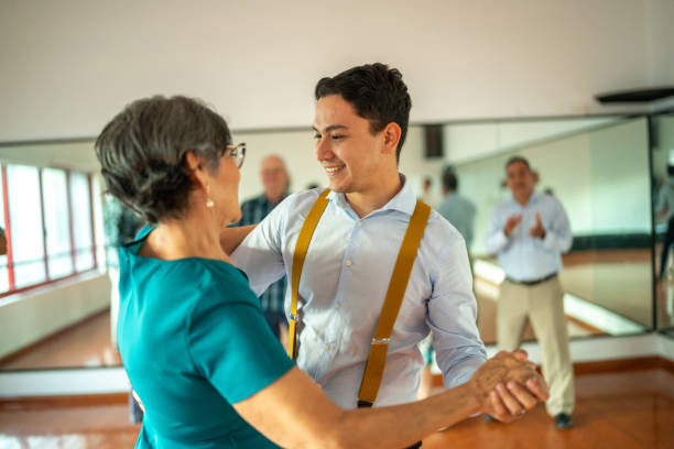 istock Senior woman dancing with dancing instructor at a dance studio 1450035856