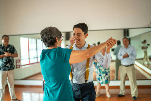 istock Senior woman dancing with dancing instructor at a dance studio 1450035866