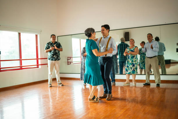 istock Senior woman dancing with dancing instructor at a dance studio 1450035925