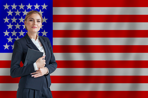 American businesswoman on the flag of USA digital  nomad, business, startup concept