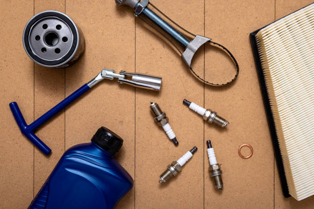 istock Spare parts for car and tools on wooden table 1450036535