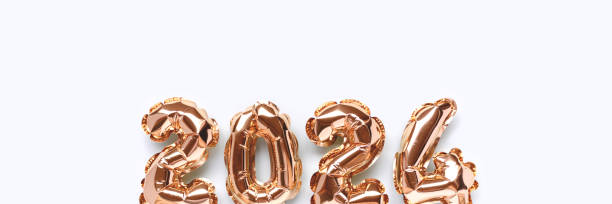 istock Banner with shiny 2024 gold inflatable balloons. 1450038159