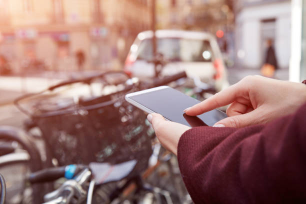 istock Pedestrian using cellphone while crossing the street. 1450038958