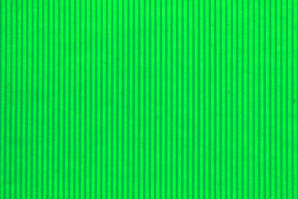 istock Abstract paper green geometric symmetrical texture striped surface vertical lines background 1450039335