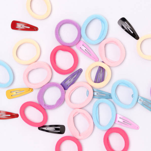 istock Many small multicolored hair scrunchies and clips. 1450039509