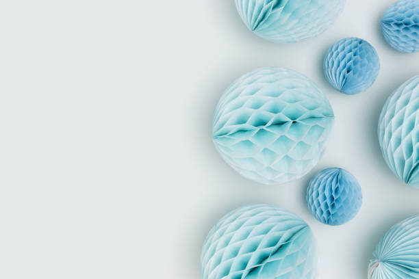 istock Tissue paper balls different sizes scattered on a blue background. 1450039875