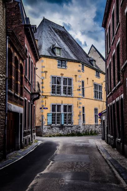 istock Empty street outside old residential buildings under a cloudy sky 1450042731