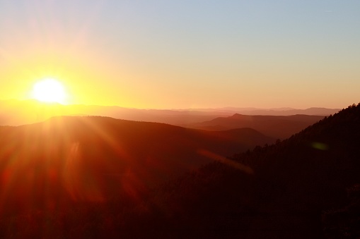 Looking west at a setting sun from the top of the Mogollon Rim in northeastern Arizona.