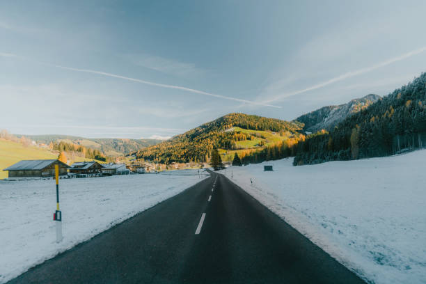 istock Road through Alps in winter 1450049713
