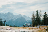 Camper van  parked in national park in Dolomites in winter
