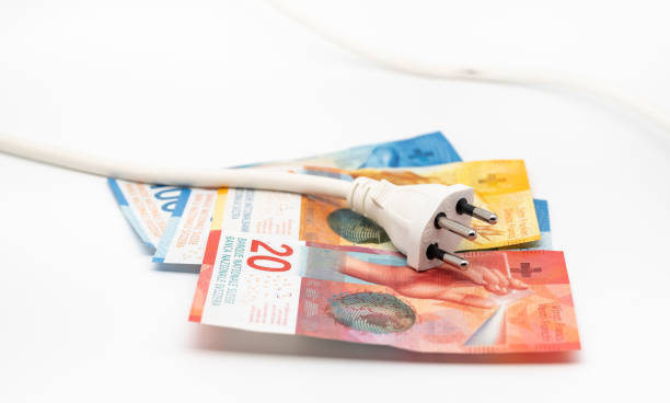istock a power plug and some swiss banknotes 1450050414