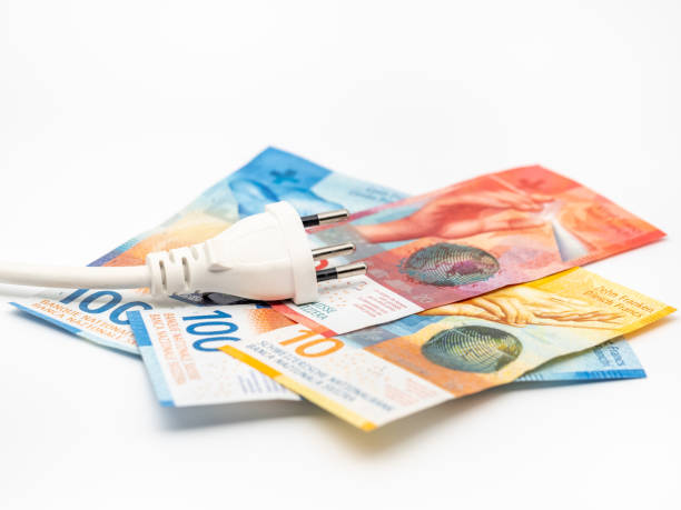 istock a power plug on some swiss franc banknotes 1450050485