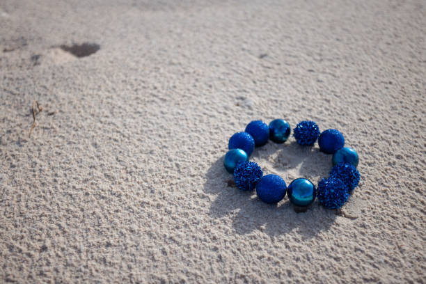 A blue set of an elegant women's necklace in a beautiful decorative bowl in the shape of a starfish