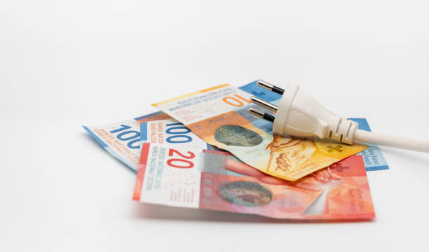 istock a power plug on some swiss franc banknotes 1450051066