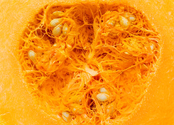 istock Background of a pumpkin cut in half. 1450052042