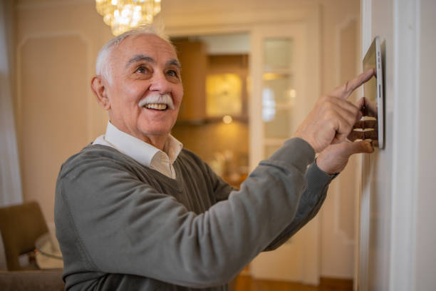 istock Man locking the door with an automated security system 1450054865