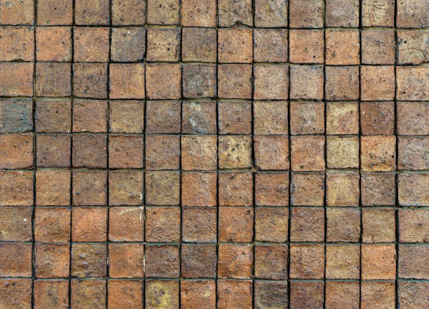 istock Brick wall. Brickwork from an old brick in a rustic style. Structure and pattern of the destroyed stone wall. Copy space 1450054940