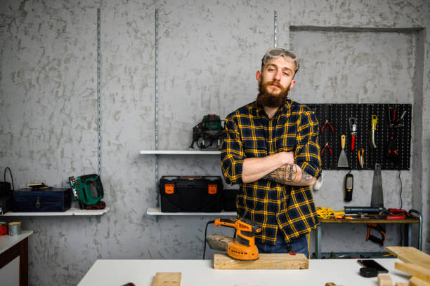 istock His is proud owner of carpenter's workshop 1450055208