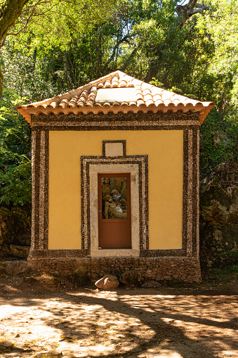 Calvary chapel in the way to the cross, via crucis, trail on ancient forest of Bussaco, in Luso, Mealhada, Aveiro in Portugal.