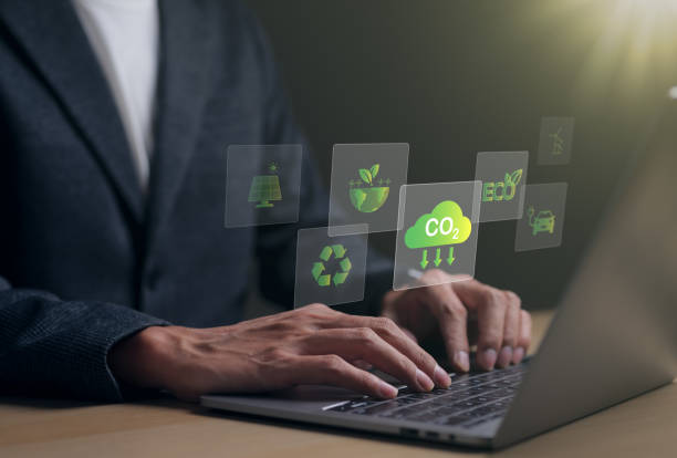 istock Reduce CO2 emission concept. Businessman using laptop for working technology Net zero and Carbon neutrality, green business and development based on renewable energy. Climate Change, Global Warming, 1450058575