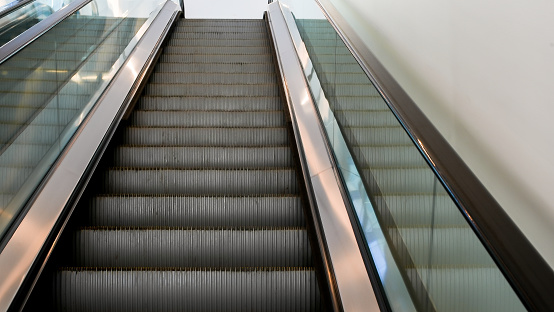 Stairs escalator close up inside modern building