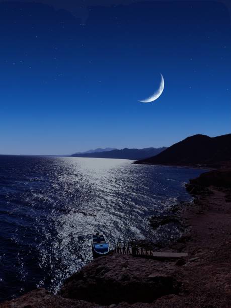 istock Scenic view of moon over the sea 1450064105