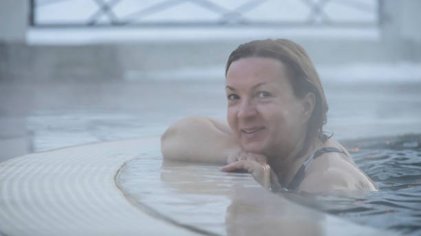 istock Joyful woman at the pool spa 1450067325