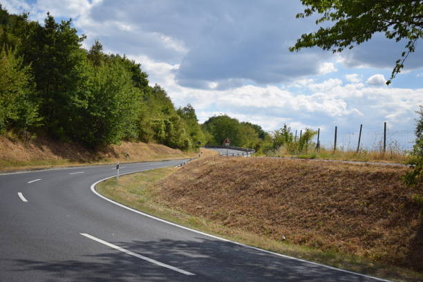 istock mountain road in summer 1450067652