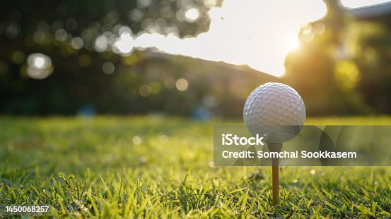 istock Golf ball on tee in a beautiful golf course with morning sunshine. 1450068257