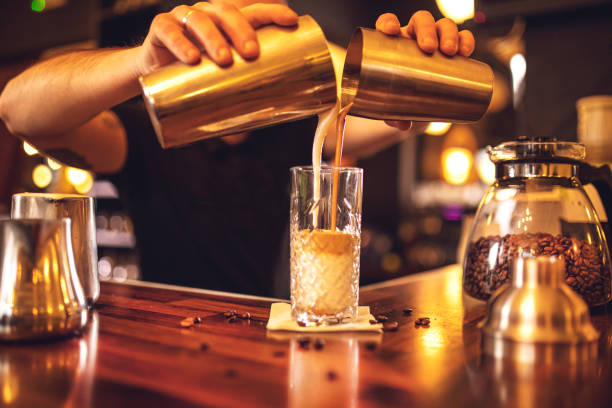 istock young male bartender working in a bar and making drinks 1450071932