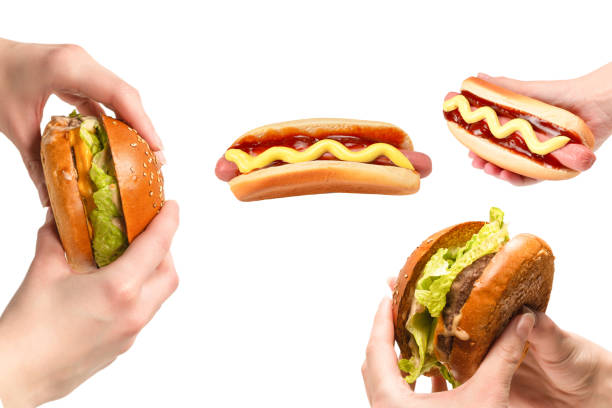 Hamburger in woman hands isolated on a white background. Top view.