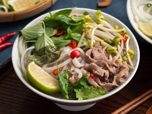 istock Delicious vietnamese beef noodles pho with ingredients. 1450074988