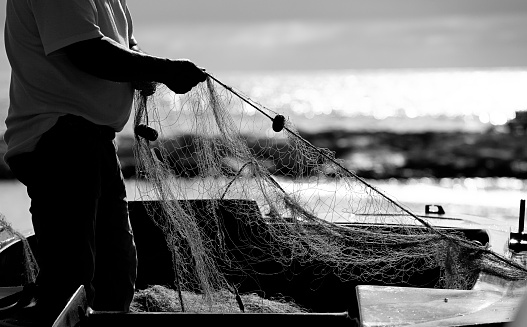 fishing nets, net texture, black and white photography of fisherman working