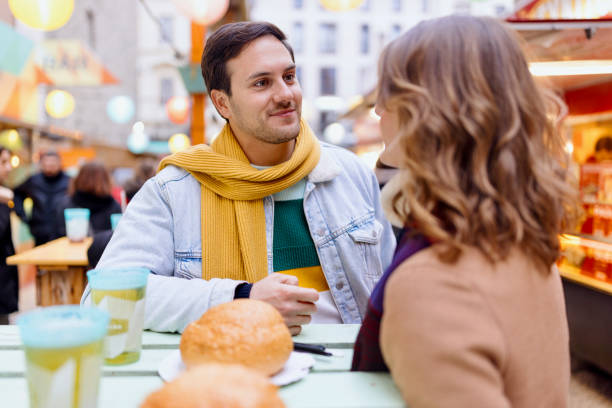 istock Young couple talking happily 1450078361