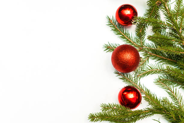 istock Christmas composition with empty frame of colorful red balls and fir-tree branches. ornament, new year decorations on white background. Mockup greetings card template with copy space, flatly, top view 1450083449