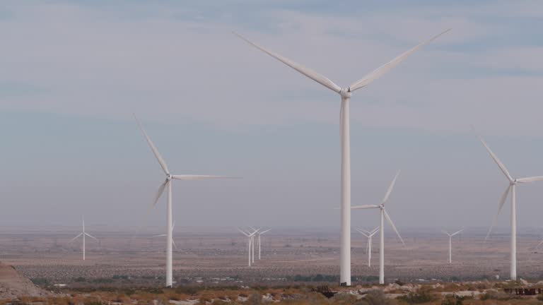 Windmills on wind farm, wind mill energy generators. Desert windfarm, USA.