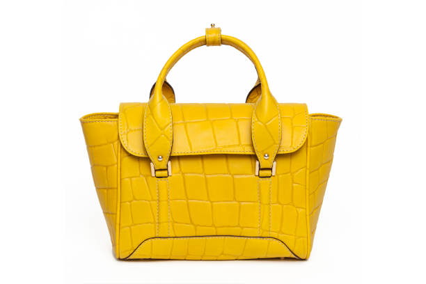 istock yellow leather handle bag for women isolated on white background. Front view of handmade leather bag. Top-handle shopper tote for contemporary women 1450087421