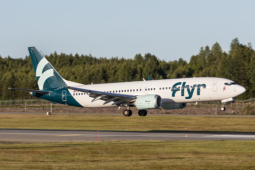 A Flyr Airlines Boeing 737 MAX arriving Oslo Gardermoen airport on a sunny evening