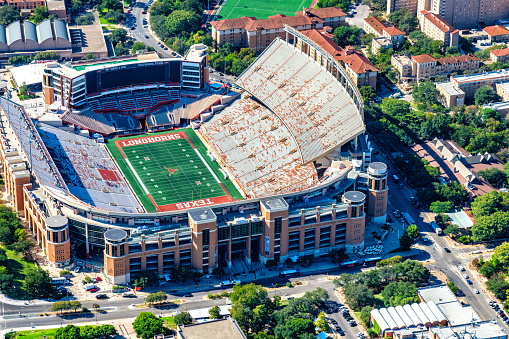 Austin, United States - September 29, 2022:  Aerial view of the Darrell K. Royal - Texas Memorial Stadium on the campus of the University of Texas at Austin which seats over 100,000 and is the home of the Texas Longhorns.