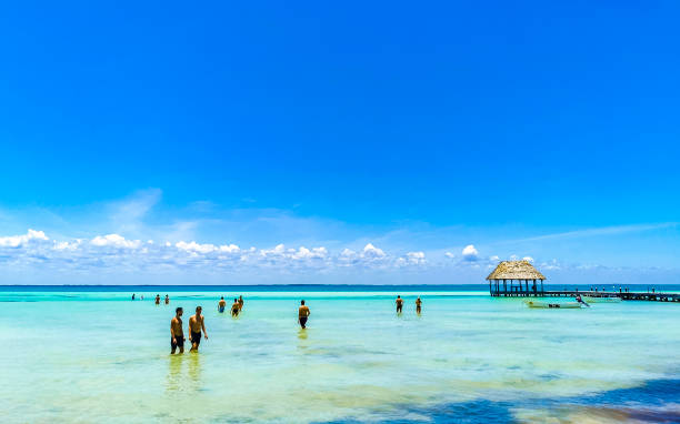 Holbox Quintana Roo Mexico 17. May 2022 Panorama landscape view on beautiful Holbox island Punta Coco lagoon sandbank and beach with waves turquoise water and blue sky in Quintana Roo Mexico.