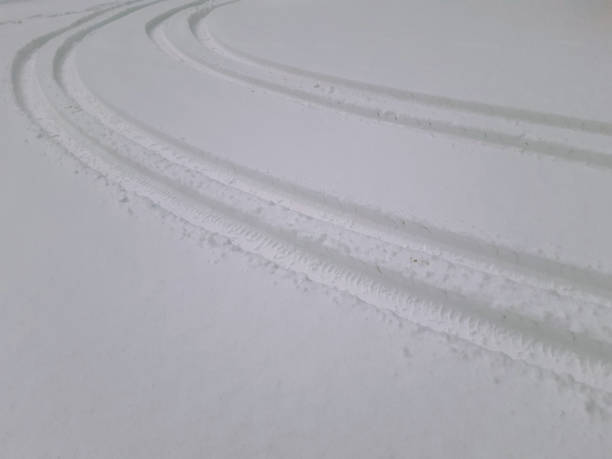istock Texture of the snow is a snowdrift in backlighting. Falling small snowflakes in backlighting. Abstract rack of the car. Selective focus. 1450103113