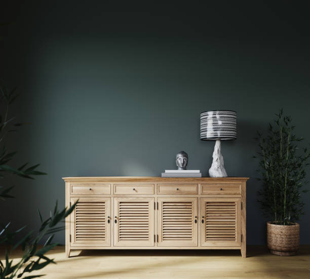 istock Modern interior with wooden sideboard and plants on green wall background 1450105138