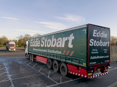 Strensham, England - December 2022: Side view of an articulated lorry operating by the Eddie Stobart trucking company