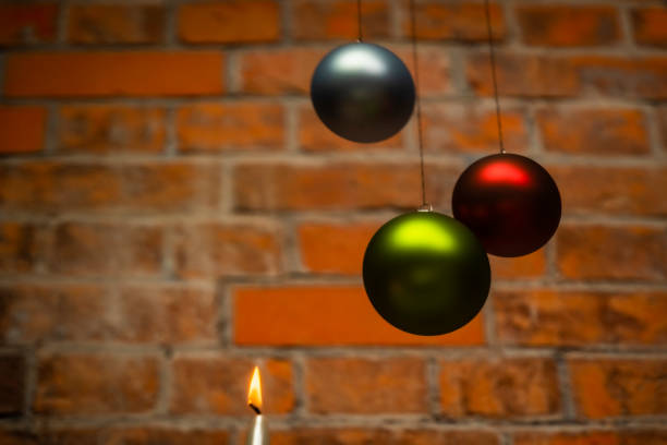 Color Christmas balls hanging interior with dark red background