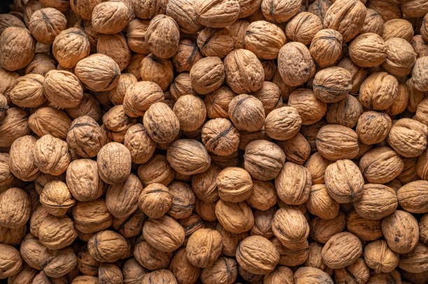 istock Walnuts, view of a large number of nuts, top down view. 1450109597
